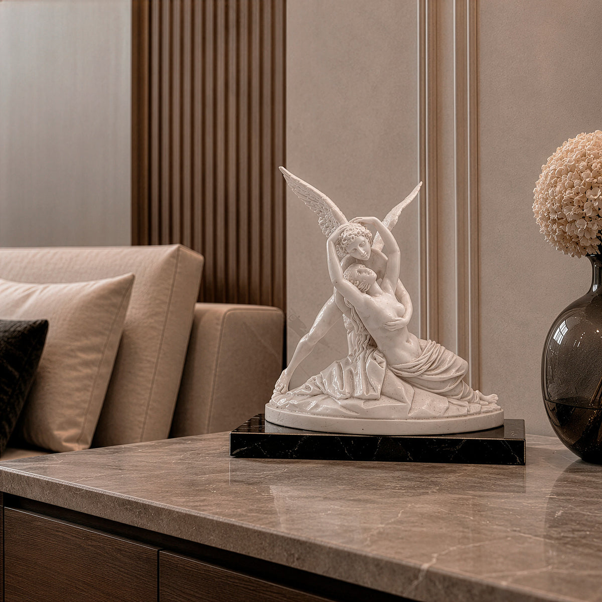 Marble statue of Cupid and Psyche seen from the front in a bedroom