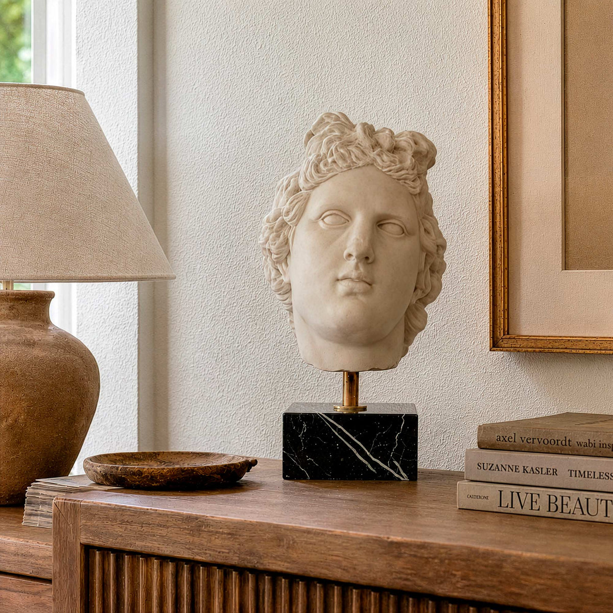 Head of Artemis in Marble from the Vatican Museums, front view on a piece of furniture