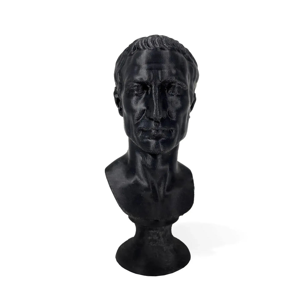 Busto di Giulio Cesare stampato in 3D nero, vista frontale su fondo bianco.