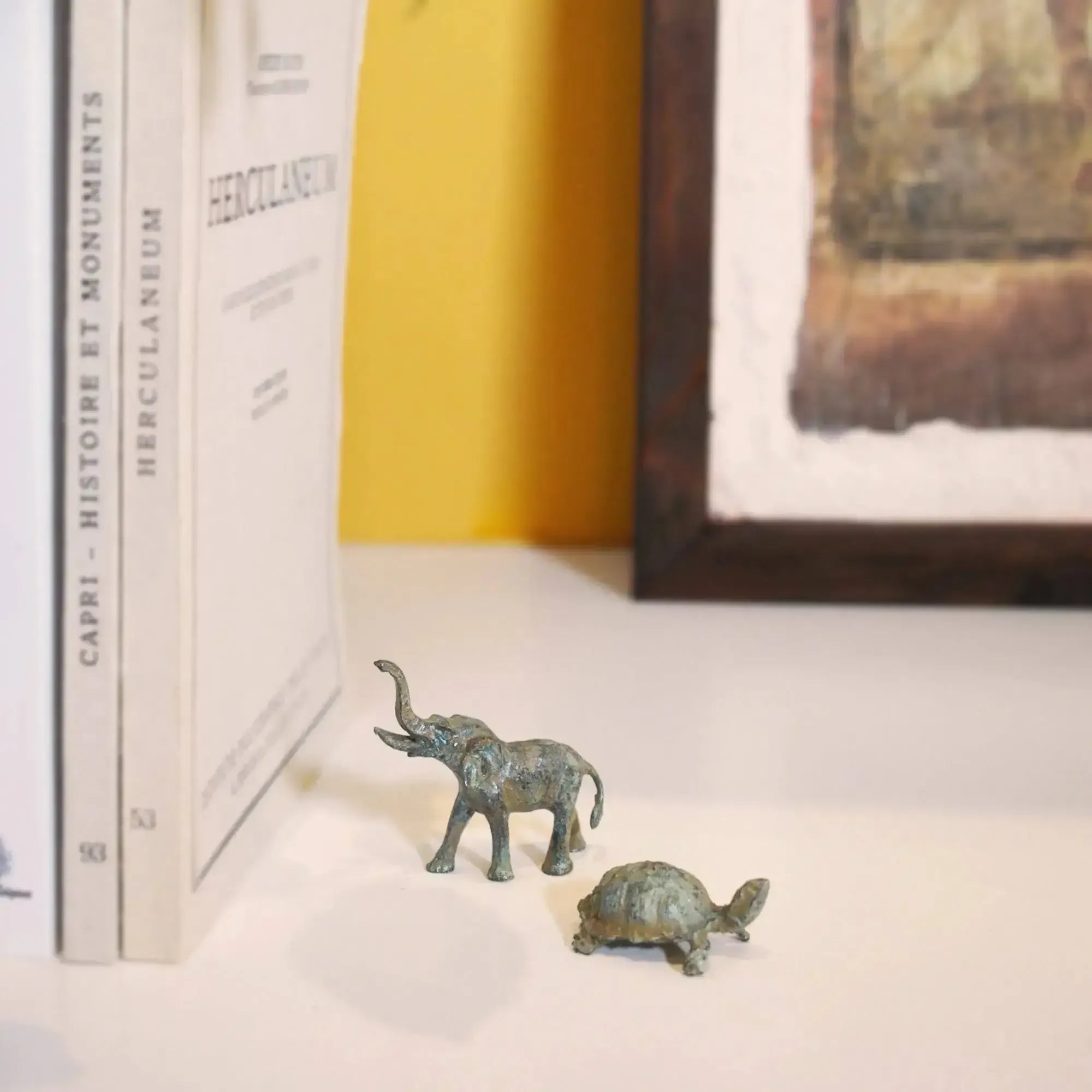bronze elephant and turtle statuettes
