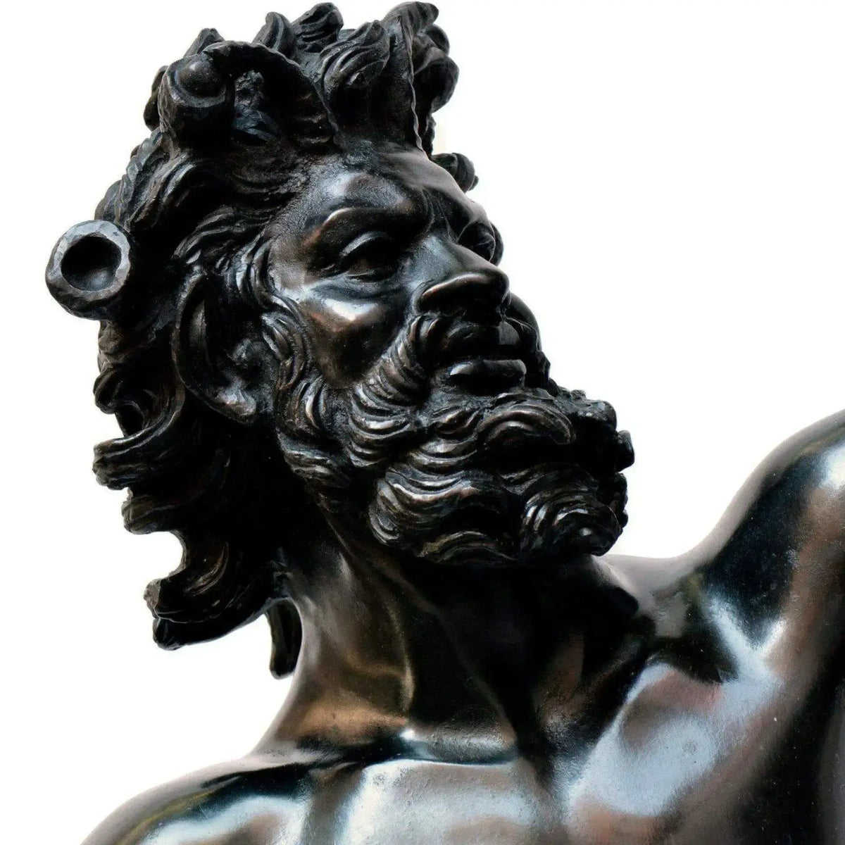 Bronze statue of the dancing faun, face detail