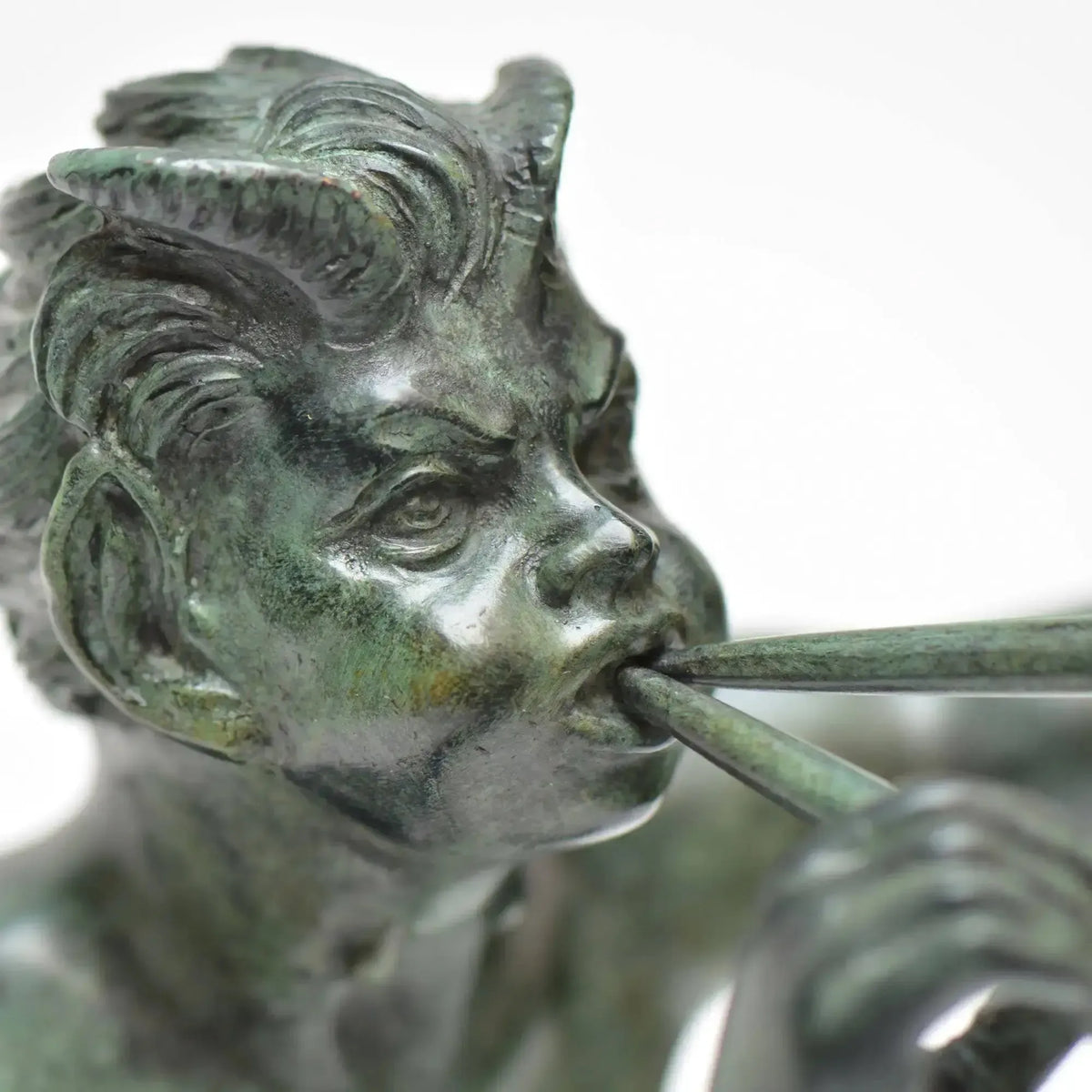 Bronze faun sculpture with fifes