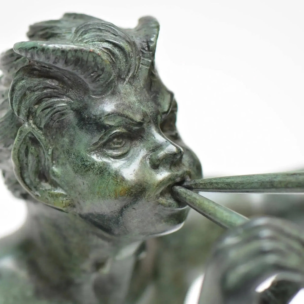 Faun with bronze pipes