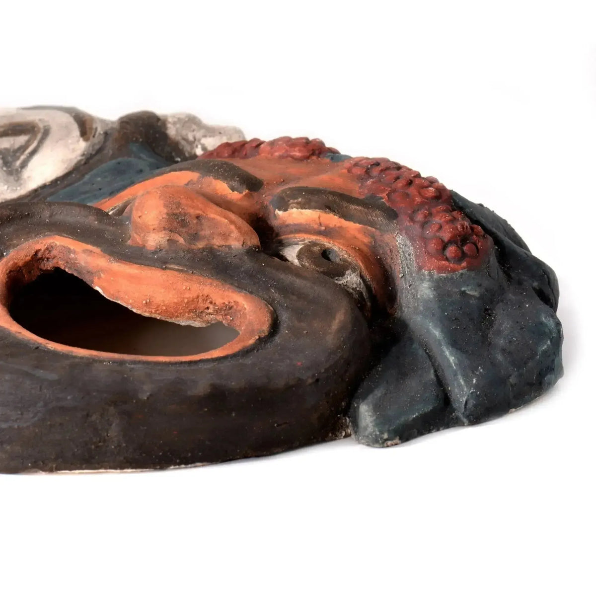 Tragic terracotta mask, typical of the Pompeian theatre