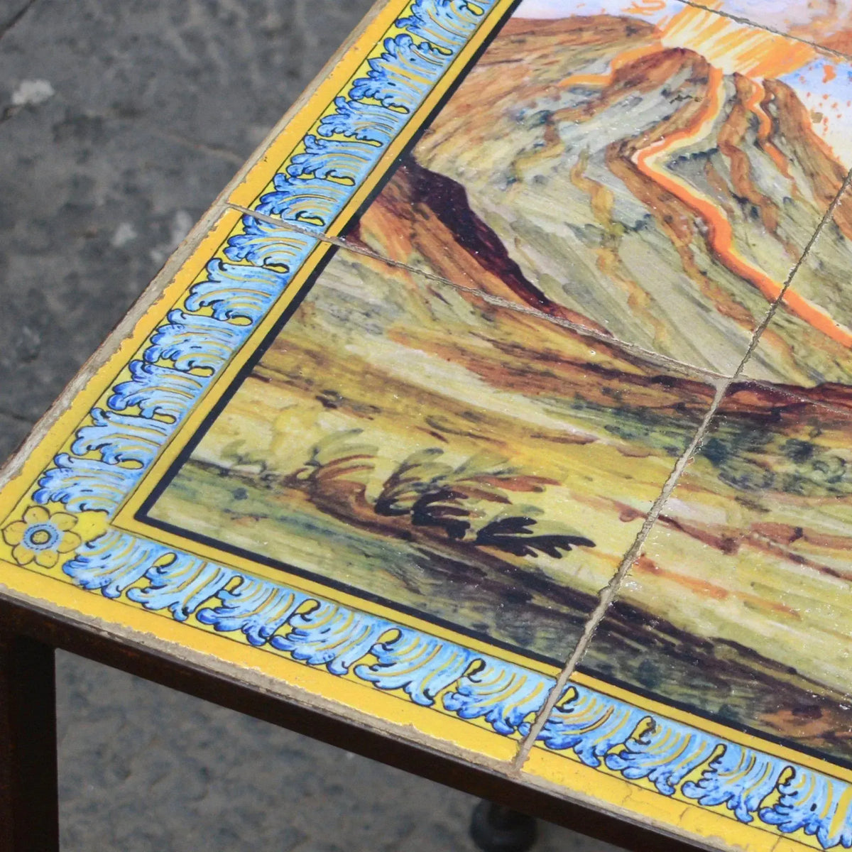 Detail of the corner of the table with our panel inspired by the majolica of Santa Chiara