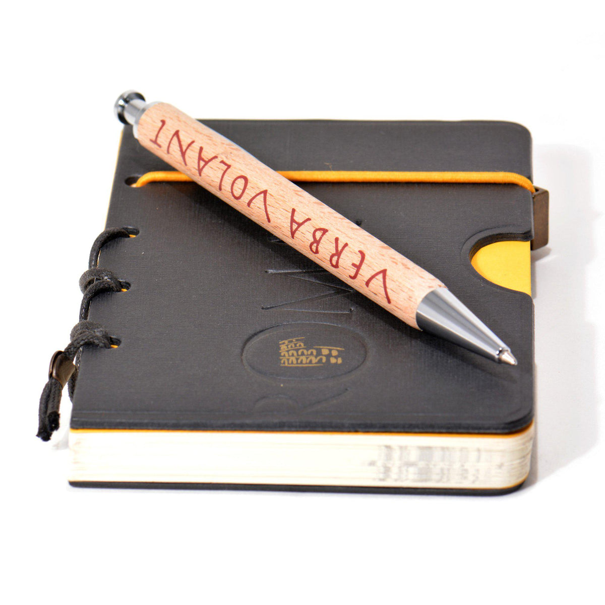 Wooden Parker pen with "Verba Volant" engraving placed on Rome notebook – writing accessories inspired by classical culture